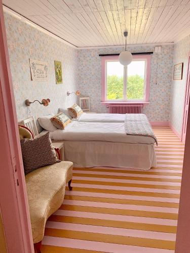 Ένα ή περισσότερα κρεβάτια σε δωμάτιο στο Strömma Farmlodge B&B