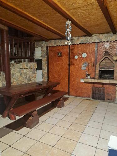 a dining room with a table and an oven at Casa Cipri si Alex in Şimon