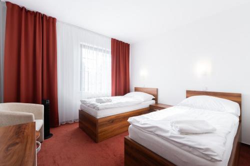 Cama o camas de una habitación en Hotel Širák