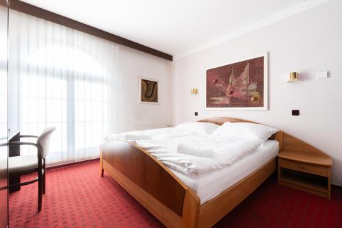 Cama o camas de una habitación en Hotel Širák