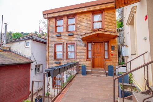 a house with a wooden door and a balcony at Bosphorus view willas in Istanbul
