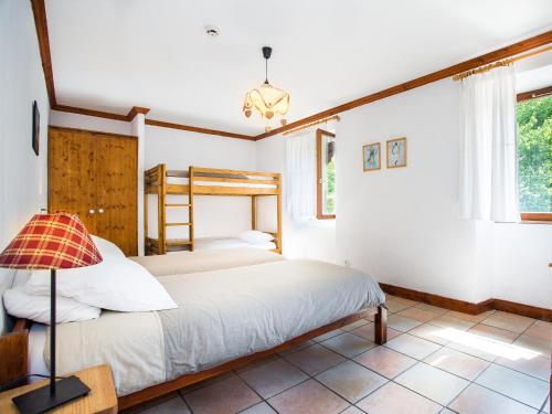 a bedroom with two beds and a window at Gite-Auberge de Montvilliers in Aime