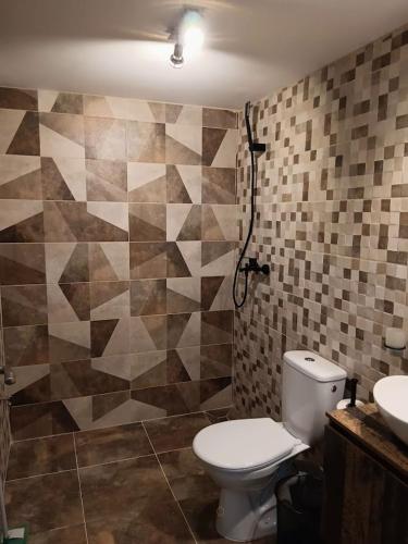 a bathroom with a toilet and a sink at Casa IRI - plaja Corbu in Corbu