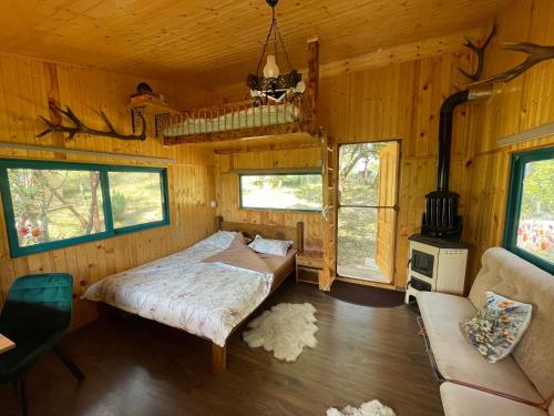 Postel nebo postele na pokoji v ubytování The Realm of Abundance Cottage