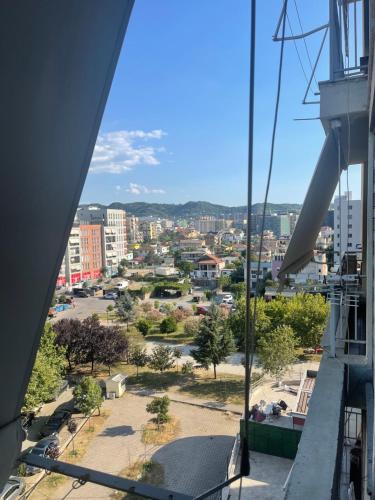 a view of a city from the balcony of a building at Sol Zoja Fusha e Aviacionit in Tirane