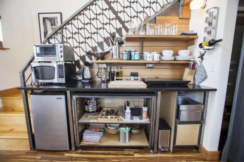 a kitchen with a counter with a microwave and acomputer at Blue Door Micro-Loft in Portland