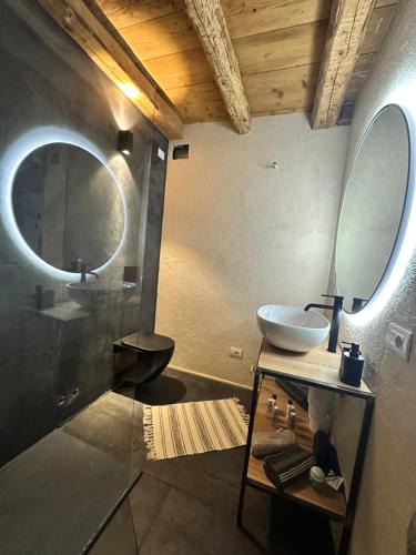 a bathroom with a sink and a mirror at La finestra sul grappa in Seren del Grappa