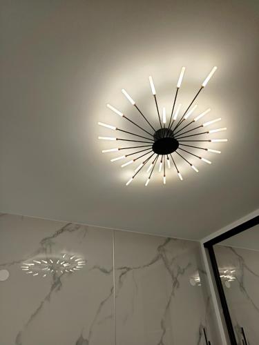 a light on the ceiling of a bathroom at Olga Luxury Apartment in Paralia Katerinis