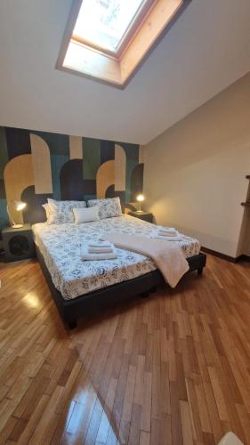 Postel nebo postele na pokoji v ubytování Casa Théméo - Centro città Verbania Intra
