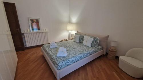 Postel nebo postele na pokoji v ubytování Casa Théméo - Centro città Verbania Intra