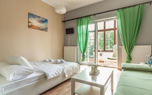 Postel nebo postele na pokoji v ubytování Central Sopot