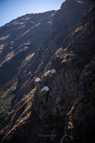 an aerial view of a mountain with houses on it at Vertical Sky Suites in Ollantaytambo