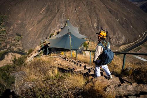 a man standing on top of a mountain at Vertical Sky Suites in Ollantaytambo