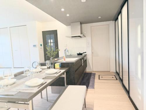 a kitchen with a table and a sink and a counter at Kamimashikigun - House - Vacation STAY 18866 in Takemiya