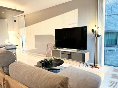 a living room with a couch and a flat screen tv at Kamimashikigun - House - Vacation STAY 18866 in Takemiya