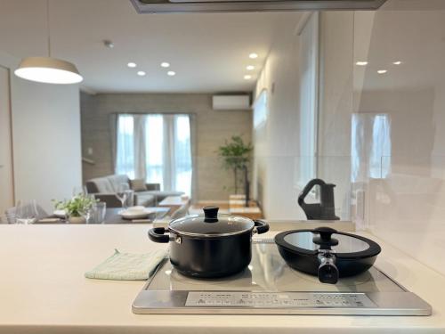 a pot sitting on top of a stove in a kitchen at Crystal Flame Lodge Waifu 1 - Vacation STAY 18936 in Kikuchi