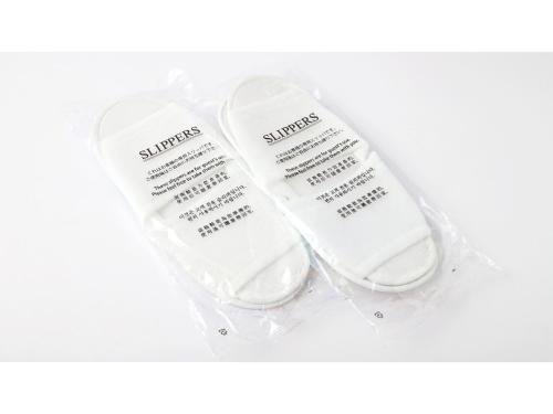 two white toothbrushes sitting in a plastic bag at Smile Hotel Shimonoseki - Vacation STAY 96732v in Shimonoseki