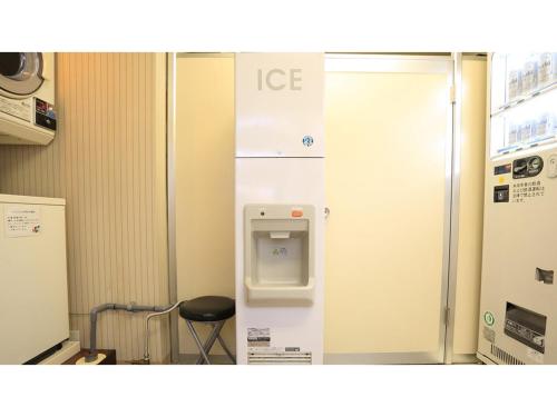 an ice machine in a room with a chair at Smile Hotel Shimonoseki - Vacation STAY 96720v in Shimonoseki