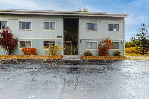 a building with a parking lot in front of it at Twin Rivers 3 in Fraser