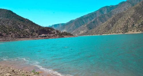 a body of water with mountains in the background at Kasbah de Ouirgane in Ouirgane