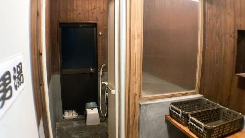 a small bathroom with a sink and a mirror at Minshuku Misakiso - Vacation STAY 89790v in Miyazaki