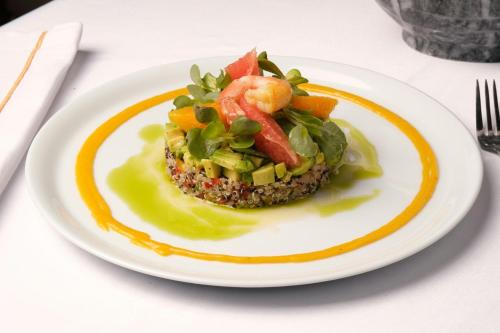 a plate of food with a salad on a table at Sanasaryan Han, a Luxury Collection Hotel, Istanbul in Istanbul