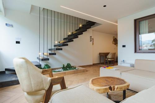 a living room with a couch and a table at Hotel CASA TAMA in Salento