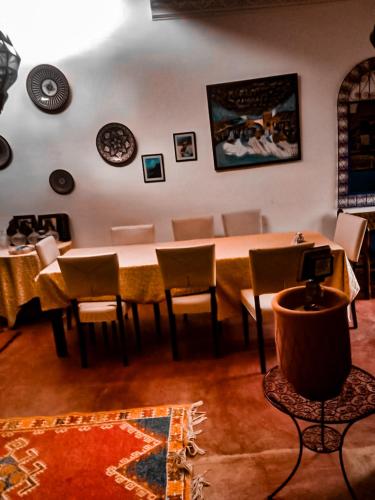 a dining room with a table and chairs at Kasbah de Ouirgane in Ouirgane