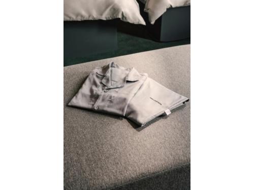 a jacket sitting on the floor next to a bed at BASE LAYER HOTEL NAGOYA NISHIKI - Vacation STAY 98099v in Nagoya