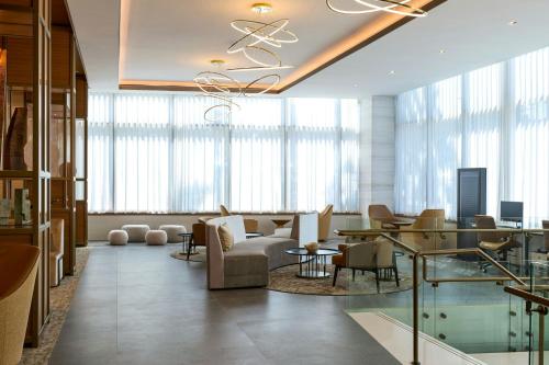 a living room with a couch and a table at The Westin Flushing LaGuardia Airport in Flushing