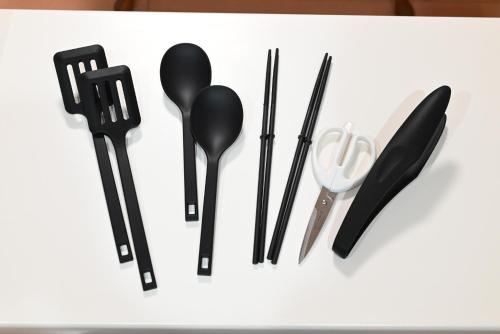 a group of black kitchen utensils on a white counter at Japanese Light - Vacation STAY 00130v 