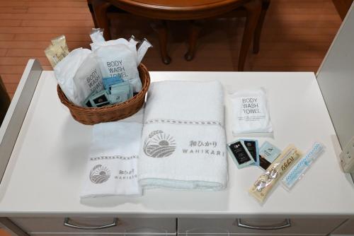 a white table with towels and a basket on it at Japanese Light - Vacation STAY 00130v 