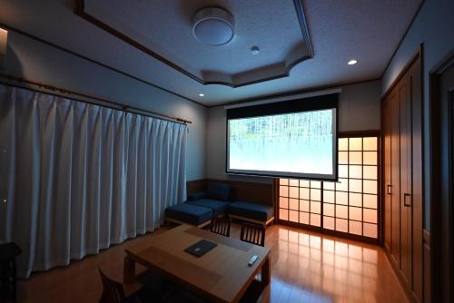 a living room with a large screen in a room at Japanese Light - Vacation STAY 00130v 
