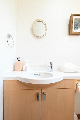 a bathroom with a sink and a mirror at Japanese Light - Vacation STAY 00130v 