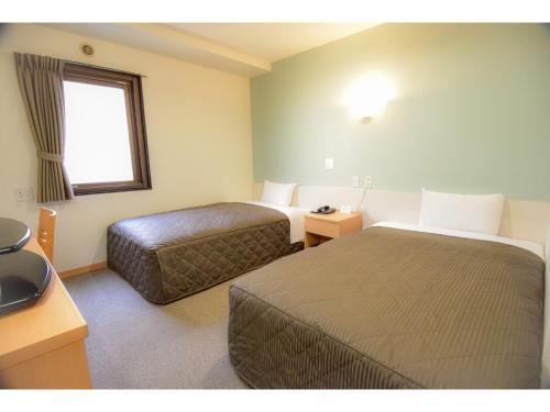 เตียงในห้องที่ Kamata Inn Social - Vacation STAY 03309v