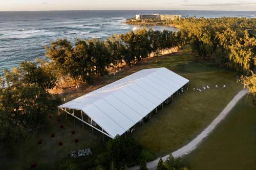 an overhead view of a white building on the beach at The Ritz-Carlton O'ahu, Turtle Bay in Kahuku