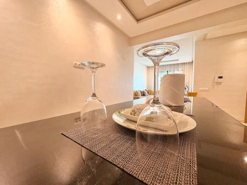 two wine glasses sitting on top of a table at cozy furnished studio fully equipped in Casablanca