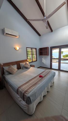 Ένα ή περισσότερα κρεβάτια σε δωμάτιο στο Bularangi Villa, Fiji