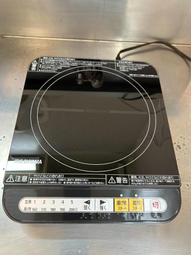a laptop computer with a cord on top of it at Rodman TONE A102 - Vacation STAY 06233v in Kitakyushu