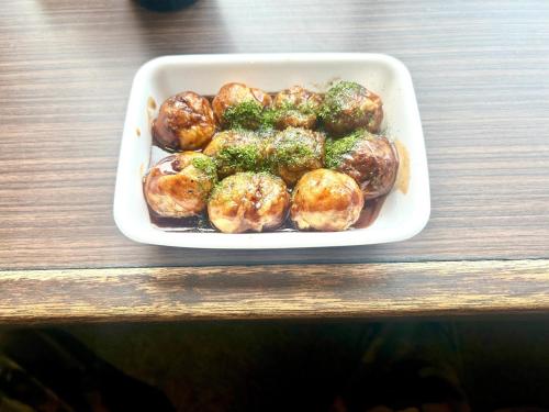 a white tray of food on a wooden table at Rodman TONE A102 - Vacation STAY 06233v in Kitakyushu