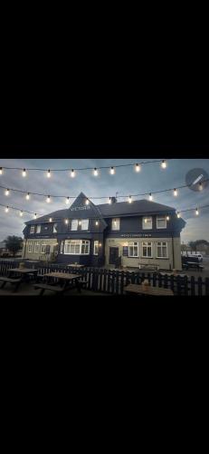 a large building with lights on top of it at Victoria Inn in Washington