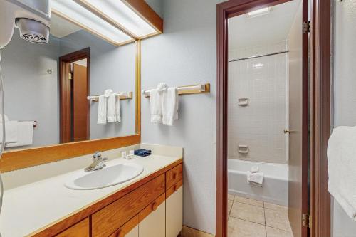 a bathroom with a sink and a shower at Quicksilver 1654 in Keystone