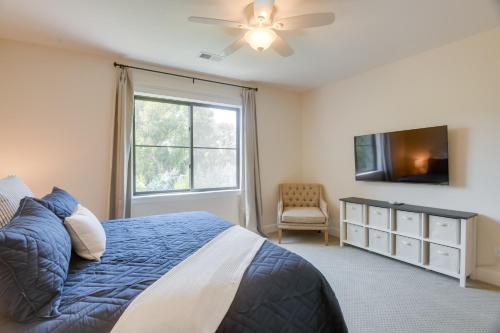 a bedroom with a bed and a tv and a window at Ski and Hike in Kelly Canyon Rigby Group Getaway in Rigby