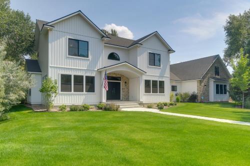 a house with a green lawn at Ski and Hike in Kelly Canyon Rigby Group Getaway in Rigby