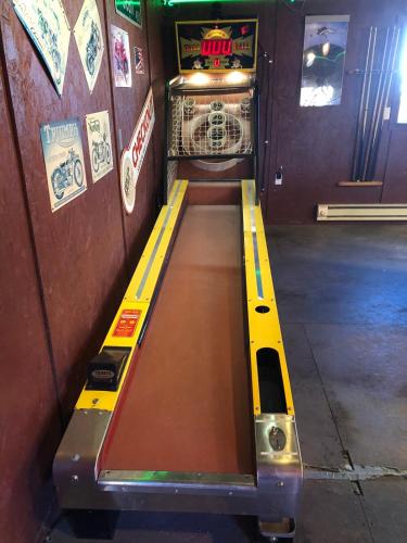 an empty bowling lane in a bowling alley at Cabin 10 at the Cedaredge Lodge in Cedaredge