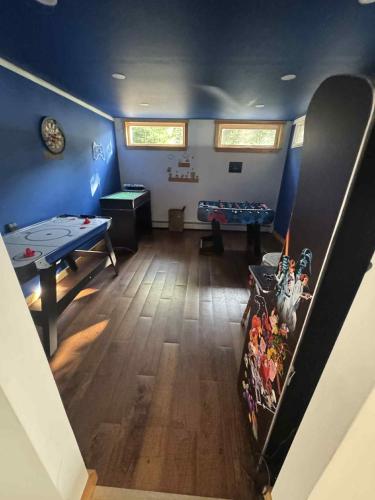 an overhead view of a room with a ping pong table at Campton Mountain Ski Retreat for Year-Round Fun -Best view and Best Price Guarantee in Campton