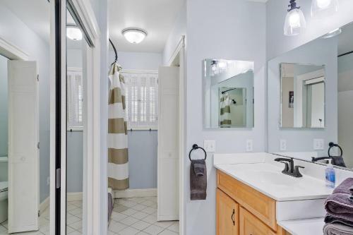 a bathroom with a sink and a shower at Charming Kennebunk Cape - Walk to Dock Square! in Kennebunkport