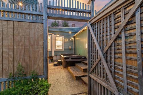 a patio with a fence and a pool table at Charming Kennebunk Cape - Walk to Dock Square! in Kennebunkport