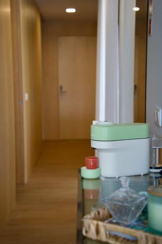 a kitchen with a table with some food on it at The Aven1da in Aveiro
