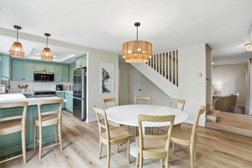 a kitchen and dining room with a white table and chairs at Solana Gem - Need to add in Solana Beach